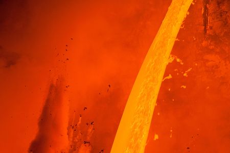 Elyse Butler got up close and personal to capture this fiery scene of lava flowing dramatically into the Pacific Ocean from Kilauea volcano.