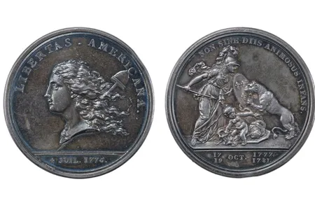 Two coins, one shows the "heads" side and one shows the "tails" side.