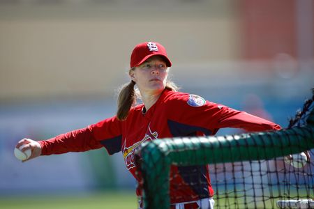 Justine Siegal pitching for the Cardinals during batting practice in 2011
