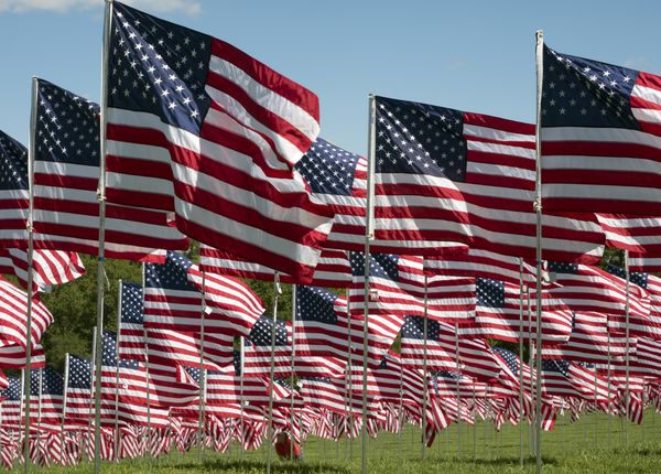 Display of flags with each flag representing a specific American who died in the line of duty since 9-11-2001 thumbnail
