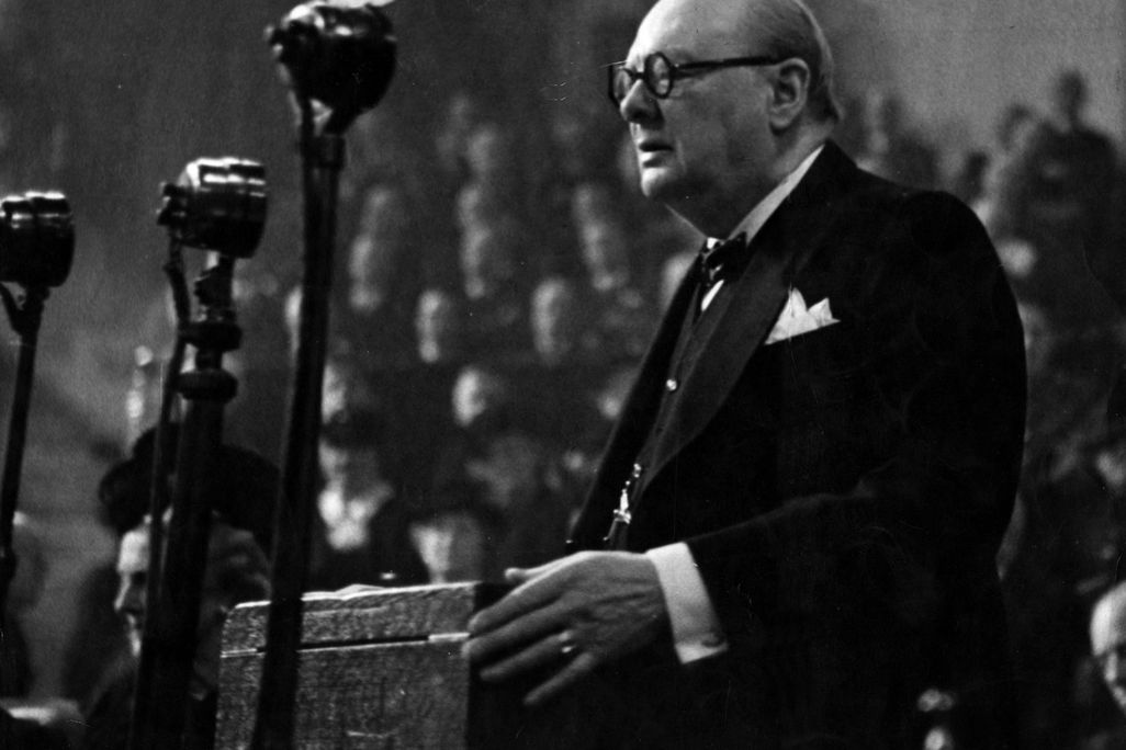 Black and white photo of Winston Churchill giving a speech