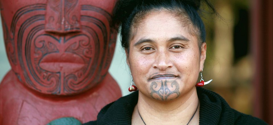  Young Maori woman with traditional Moko tattoos, New Zealand 