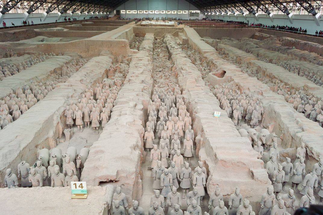 An aerial view of a pit filled with terra-cotta soldiers