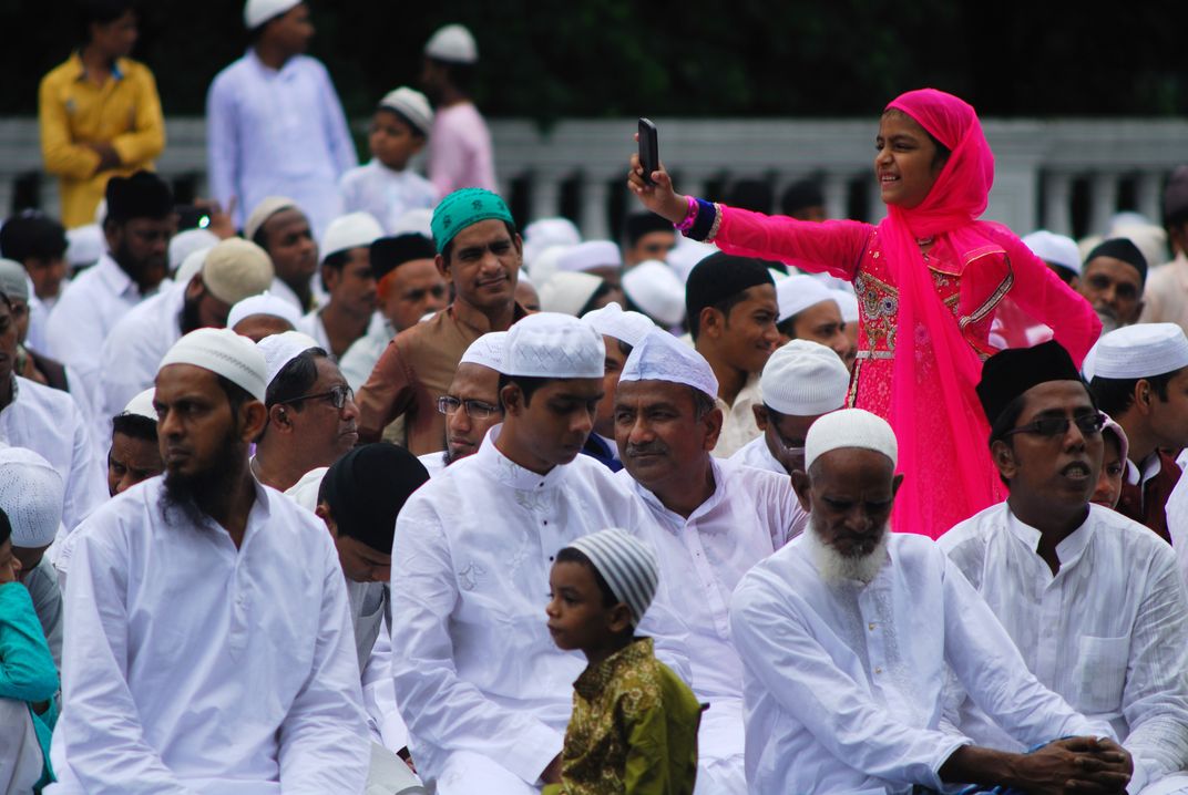 A Young Muslim Girl Takes A Selfie At The Red Road Eid ul Fitr Prayer 