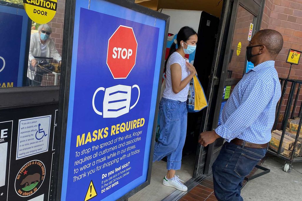 Individuals Wearing Masks Into Grocery Store