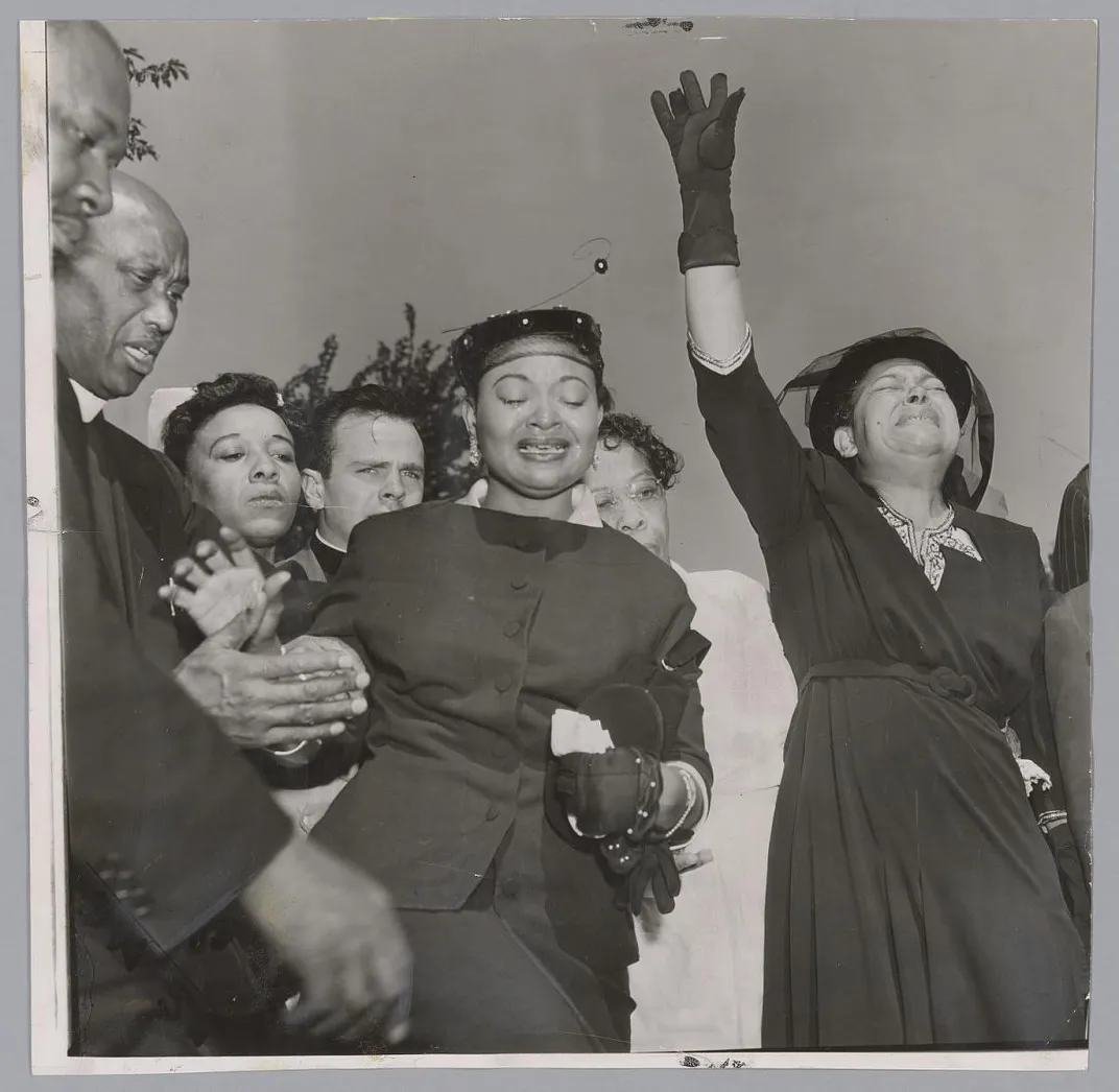 Family members grieving at Emmett Till's funeral