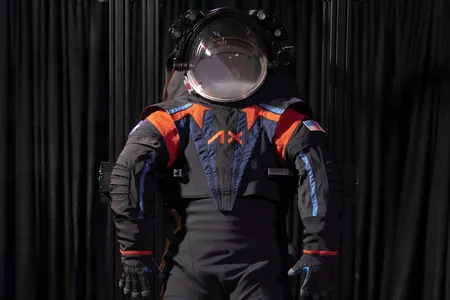 The new suits will actually be all white, but Axiom Space showed off its prototype with a dark gray cover material.
