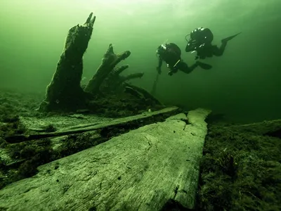Researchers Johan R&ouml;nnby and Rolf Warming examine the stern of the ship that sunk over 500 years ago off the coast of Sweden.