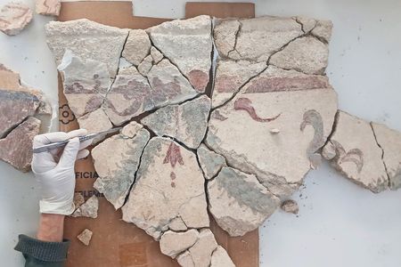 The broken walls of the villa are covered in frescoes, or paintings made on wet plaster.