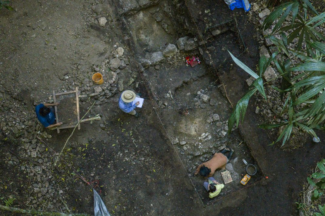 Adrian takes notes on the steps and burial crypts in an excavated structure.