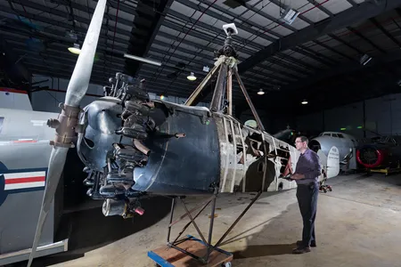 Curator Roger Connor admires the Cierva C.8W Autogiro, the United States’ oldest successful rotorcraft, which is currently in storage.