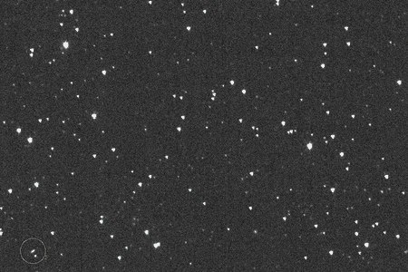 Discovery images of asteroid 2024 YR4, which is highlighted in green