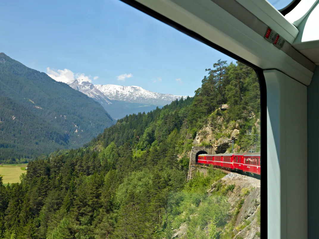 The Glacier Express traveling through a tunnel in the Alps
