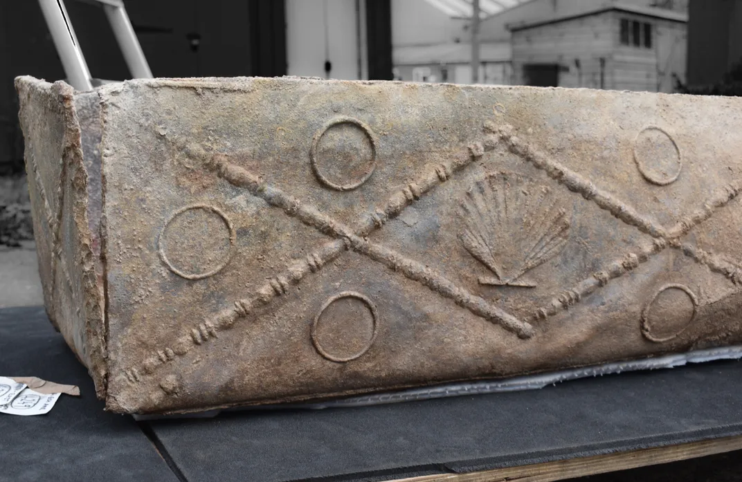 A lead coffin with decorations on it