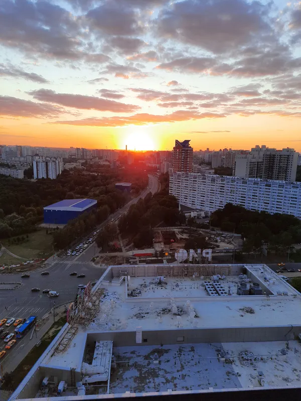 View of the sunset in the south-west of Moscow, end of the Leninskiy prospect, roof of the mall RIO Leninskiy. thumbnail
