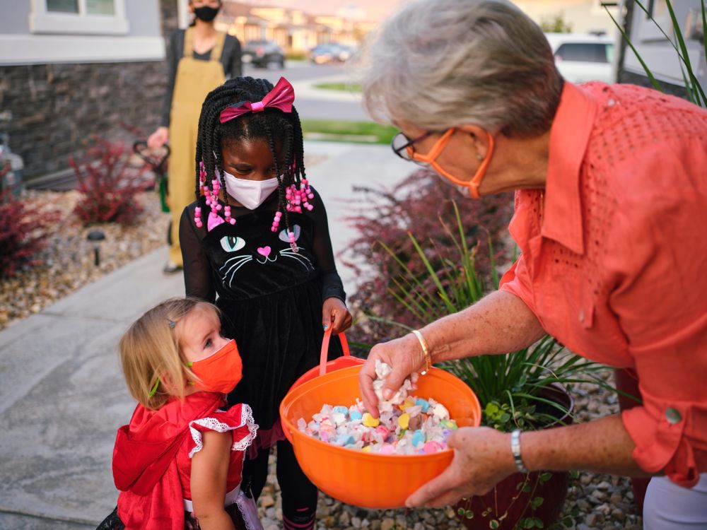 Kids trick or treating with masks on