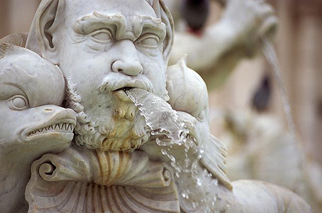 Art sculpture of ancient Italian from marble with an ice cream