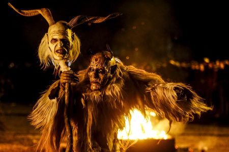 A man dressed in a traditional Perchten costume and mask performs during a Perchten festival in the western Austrian village of Kappl, November 13, 2015. Each year in November and January, people in the western Austria regions dress up in Perchten (also known in some regions as Krampus or Tuifl) costumes and parade through the streets to perform a 1,500 year-old pagan ritual to disperse the ghosts of winter.
