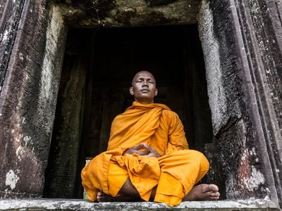 A Buddhist monk meditates in Cambodia.