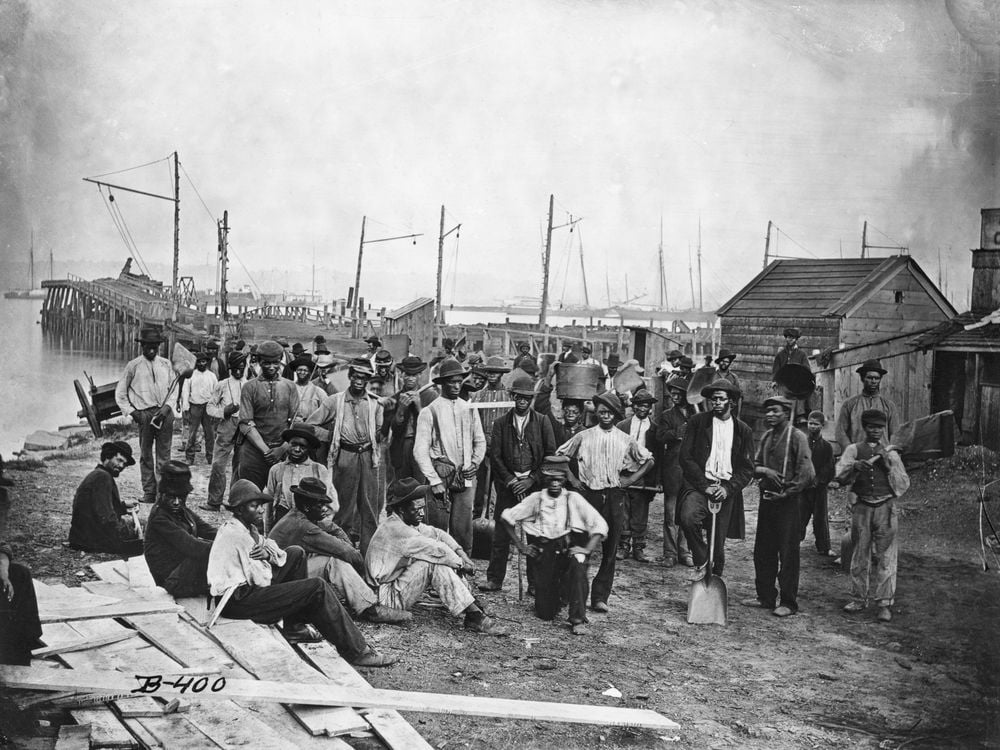 Black Americans along with a wharf