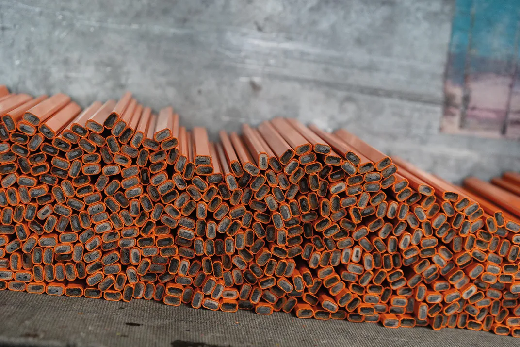 a stack or orange carpenter pencils