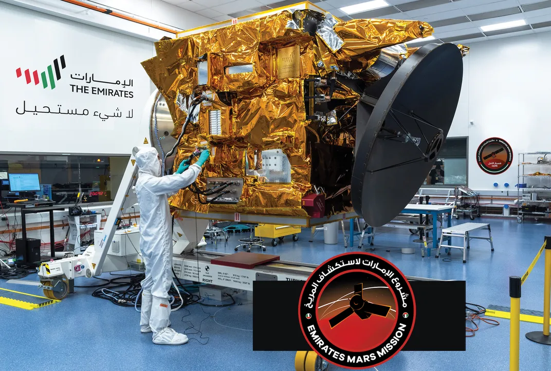 	A technician at the Mohammed Bin Rashid Space Centre in Dubai applies finishing touches to Hope