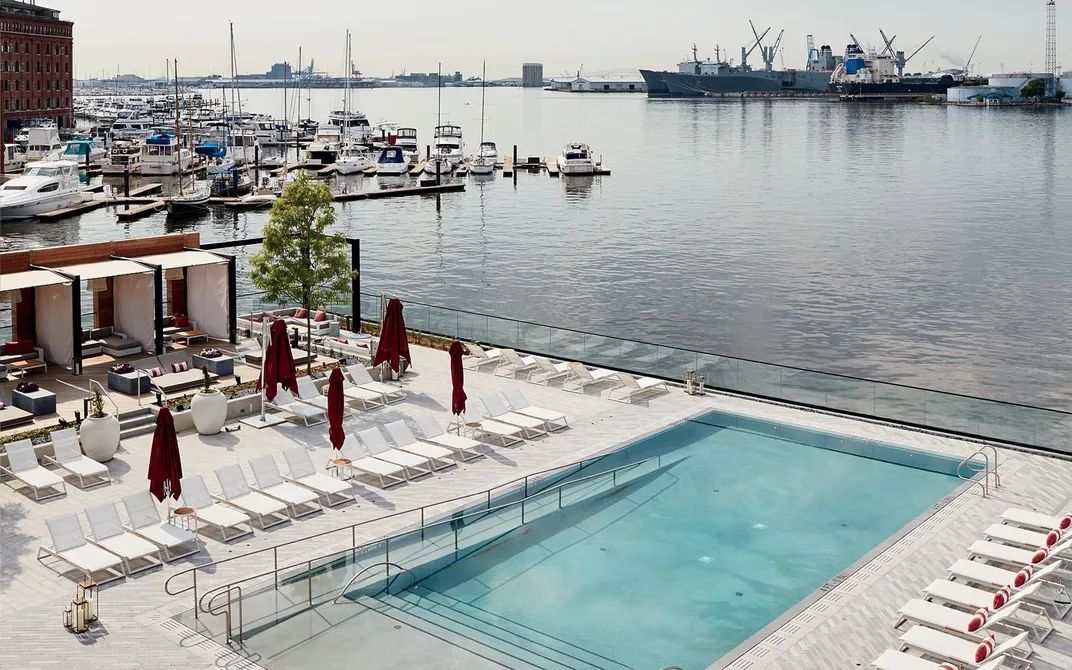 At the Sagamore Pendry Baltimore, the pool overlooks industry across the Patapsco River.