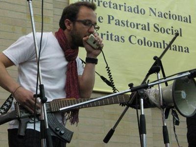 Cesar Lopez and cellist Sandra Parra perform in Bogota with his “escopetarra” at the launch of Colombia’s 2008 peace week