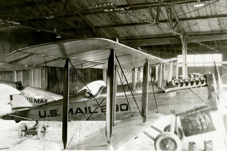 A DH-4 mailplane sits in the hangar at Bellefonte, Pennsylvania, in December 1923.