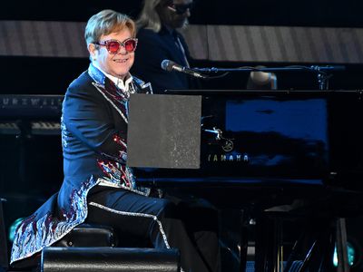 Elton John performing during his farewell tour at Dodger Stadium in Los Angeles