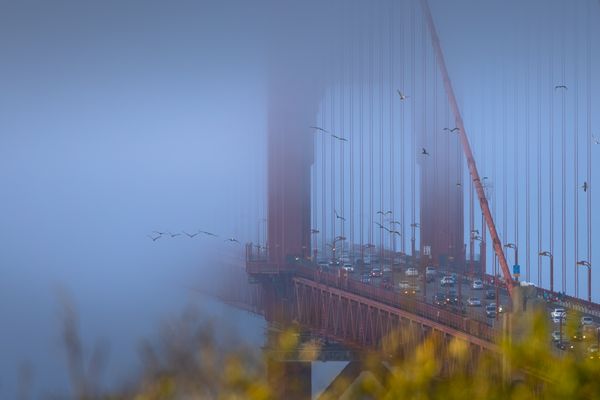 Traffic Moving Along the Golden Gate Bridge at Dusk thumbnail