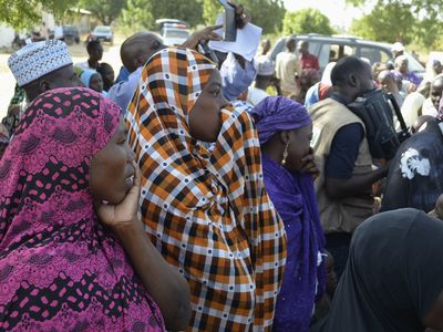 Parents of some of the kidnapped girls react during a meeting last Friday.