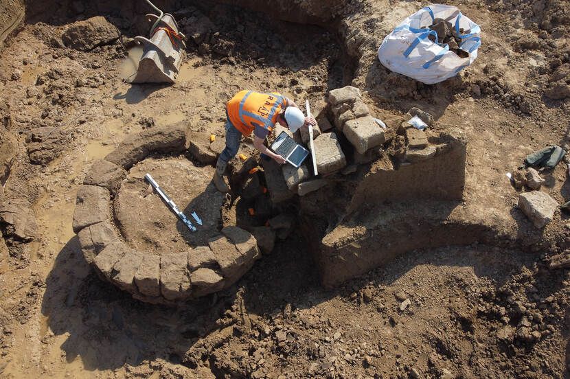 Archaeologists continue to dig around the Roman well that was discovered as part of a temple and military complex in the Netherlands.