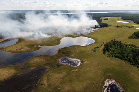 A fire in the Yakutia region of Siberia in early June seen from the air. A June heat wave saw temperatures in Verkhoyansk, a town in Yakutia, hit 100 degrees Fahrenheit.