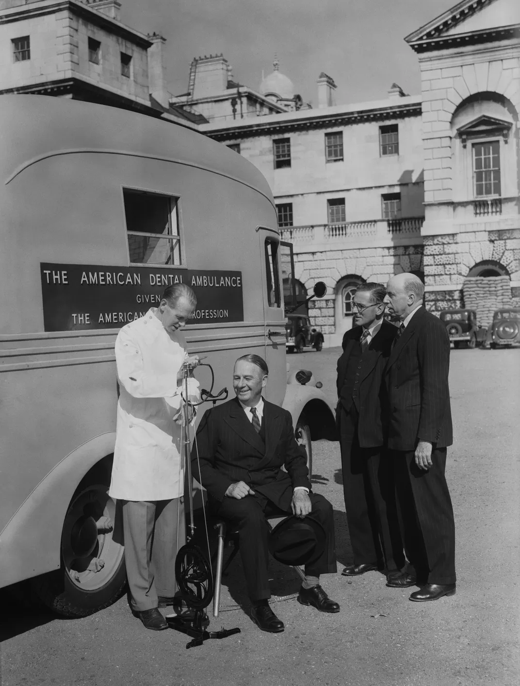 Harold Gillies (far right) watches a demonstration by a fully equipped dental ambulance at Horse Guards Parade in London in 1940