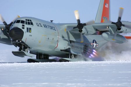 An LC-130 of the New York Air National Guard's 109th Airlift Wing gets a jet-assisted takeoff from Camp Summit, Greenland, in 2011. 