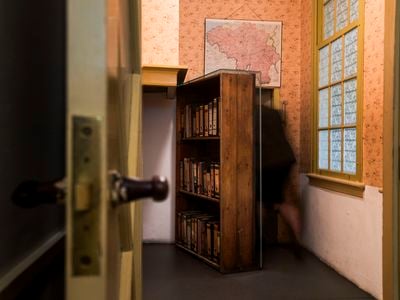 A woman enters the secret annex at the Anne Frank House Museum in Amsterdam. The new exhibition in New York will be the first full-scale replica.