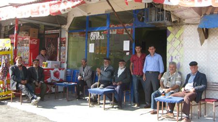 They may look friendly, but be warned: These village men will smother travelers with kindliness and drown them in tea.