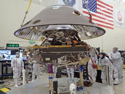 Keeping it clean: Technicians prepare the Mars Insight lander for its trip to another world. 