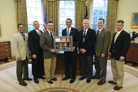 NASA's STS-119 space shuttle crew from left; Joseph Acaba, Tony Antonelli, 
Lee Archambault,  John Phillips,  Richard Arnold,  Steve Swanson, present President Barack Obama, fourth from left, with a montage in the Oval Office of the White House, Friday, May 1, 2009, in Washington.  Photo Credit: (NASA/Bill Ingalls)