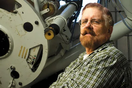 Astronomers like Rik Hill scan the heavens from Arizona looking for errant asteroids.