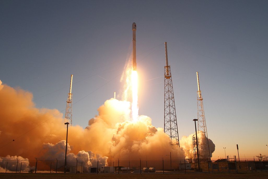 The falcon 9 spaceX rocket launching Cape Canaveral in Florida in 2015 with blue sky backdrop