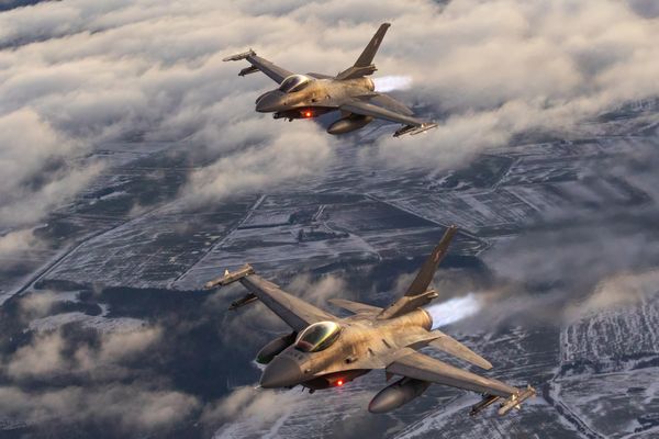 F-16s at sunset over Lithuania thumbnail