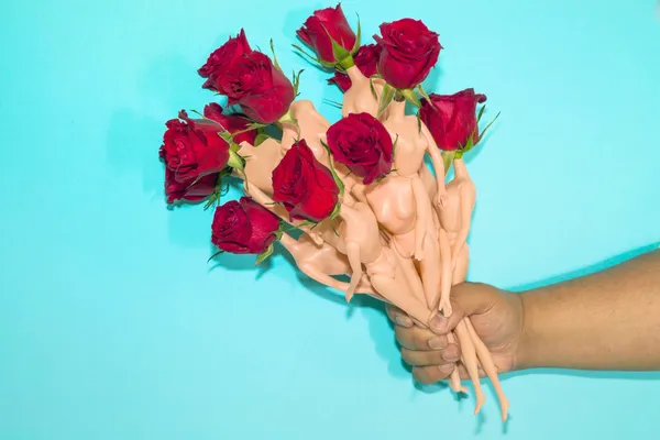 A Bouquet of Roses With Doll Bodies as Stems thumbnail