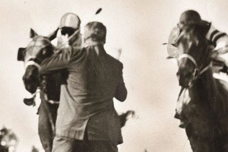 In 1966, Henry Carfagna, the Suffolk Downs track photographer, prepared to take his standard picture of the horses driving toward the wire when he saw a man run onto the track.
