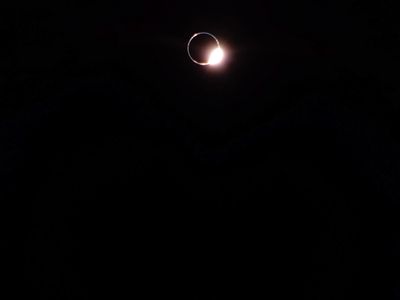 A &quot;diamond ring&quot; appears around the Earth, as seen by the Blue Ghost lander on the moon.