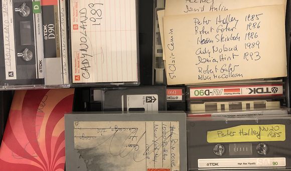 Color image of various audio recordings, some with handwritten labels.
