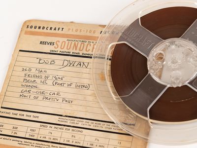 The reel-to-reel tape features four original Dylan compositions, including &quot;Song to Woody.&quot;