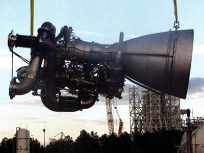 Flying at last: an AJ26/NK-33 engine gets hoisted into place.