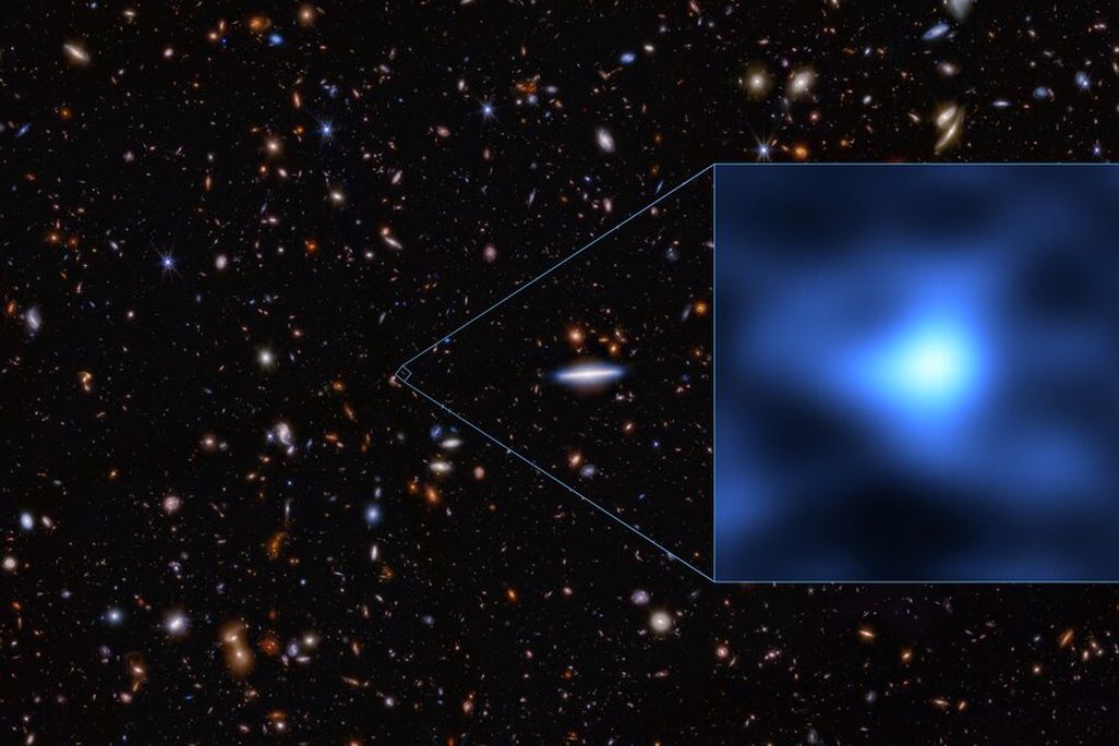 an image of several distant galaxies, with a zoom window showing JADES-GS-z14-0 as a fuzzy blue